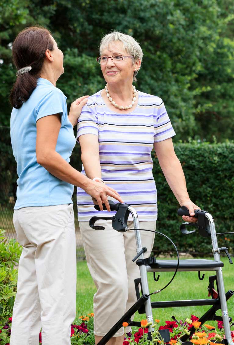 An Older Woman with a Walker and a Younger Woman