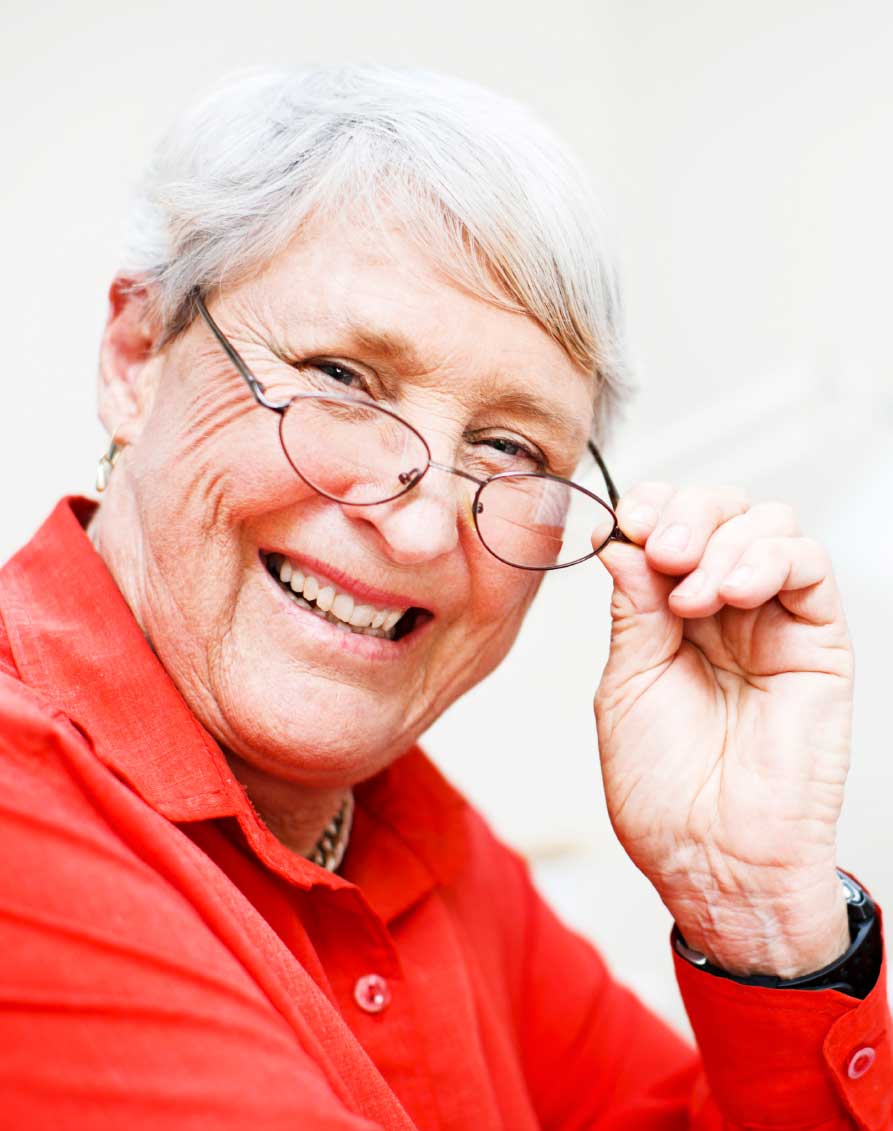 A Smiling Older Woman in Glasses