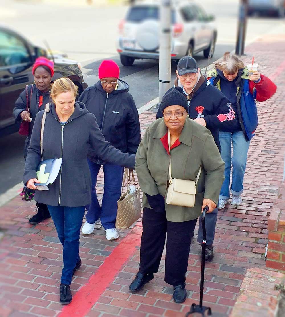Group of Older Adults on City Street With Travel Trainer