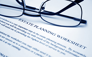 Estate planning worksheet and eyeglasses